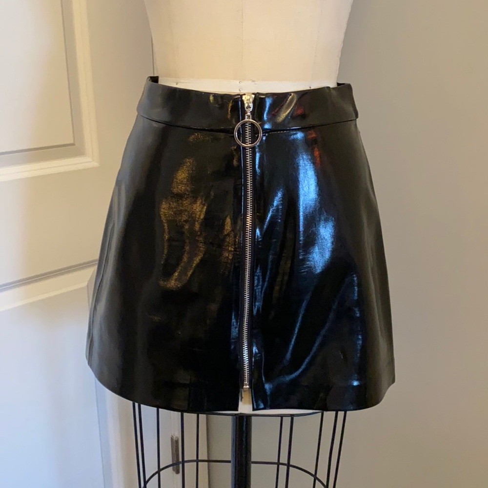 Black pleather skirt with front zipper. XS Zara